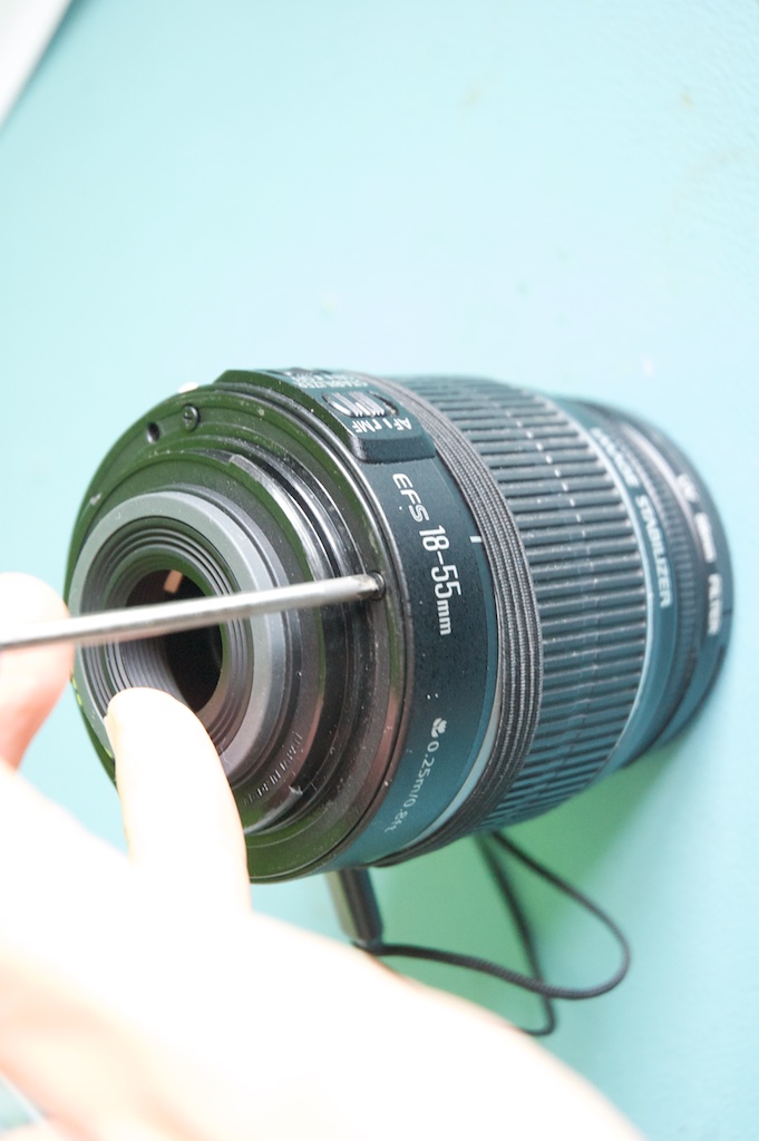 remove the screws on the rear of the lens bayonet