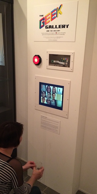 The installation is within a wooden cabinet. The Raspberry Pi can be seen in the window at the top